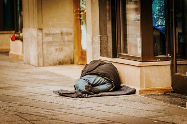 Homeless person sleeping on the floor